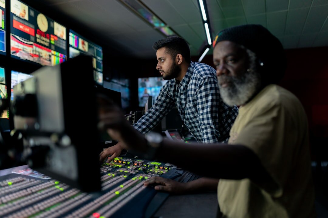 Engineer calibrating broadcast equipment in a studio